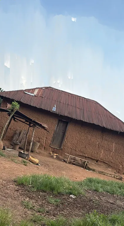 The same house with vertically sorted cloud colors forming pale columns above the roof.
